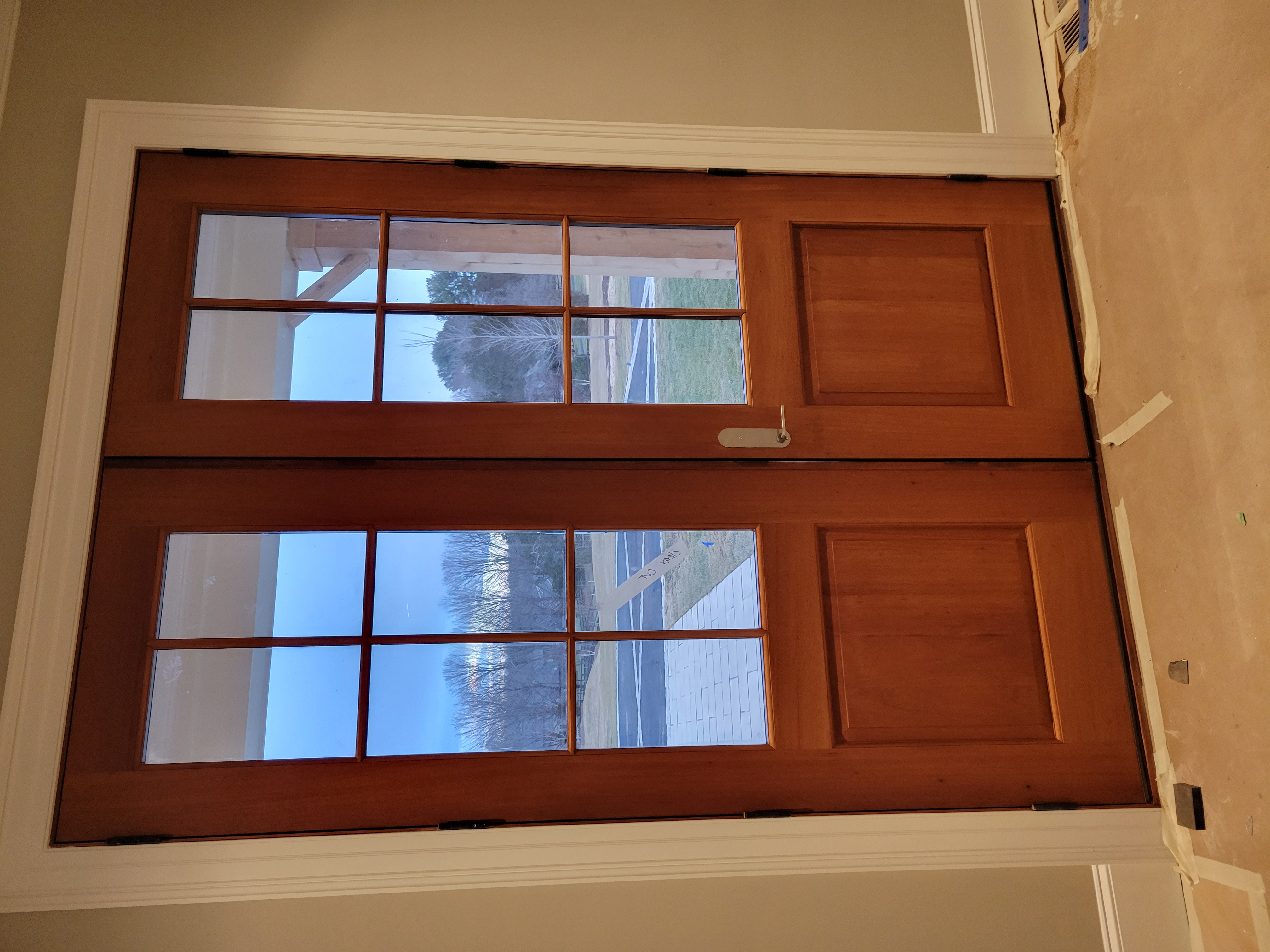Warm wood entry door with glass panels