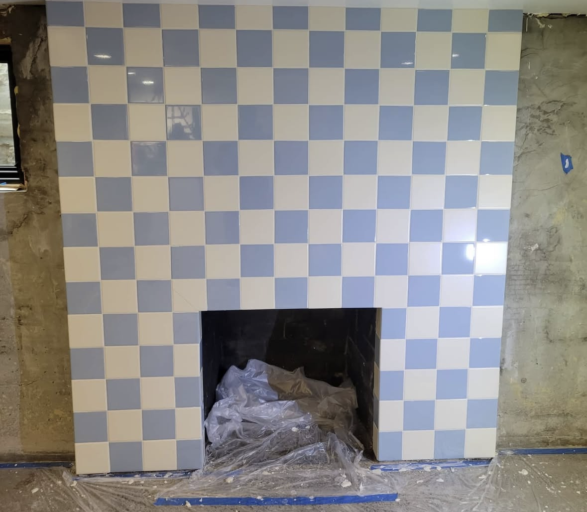 Checkerboard tile fireplace surround